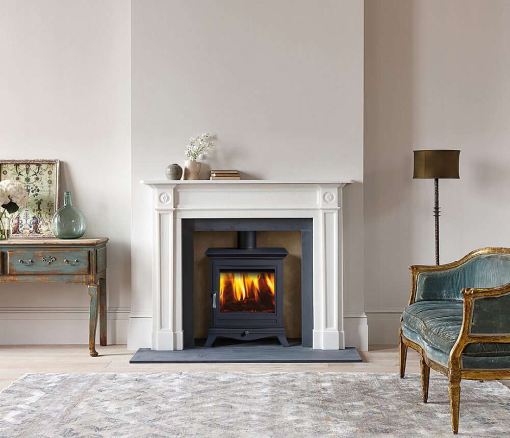 Chesney Beaumont 5WS MK3 Series installed in a white framed fireplace.