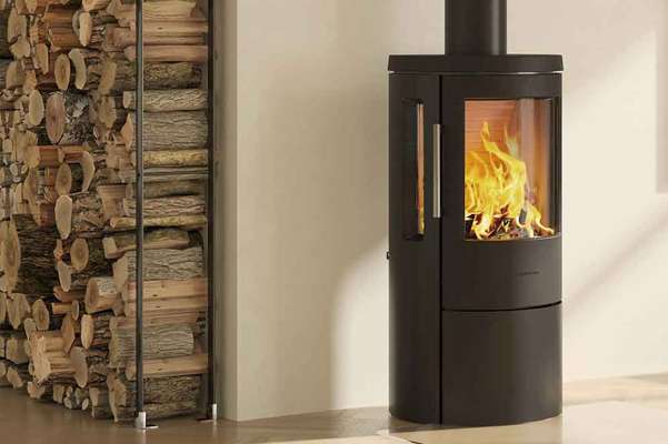 a hwam wood burning stove in a traditionally decorated living room