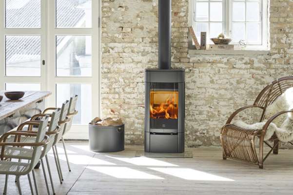 a scan wood burning stove in a traditionally decorated living room